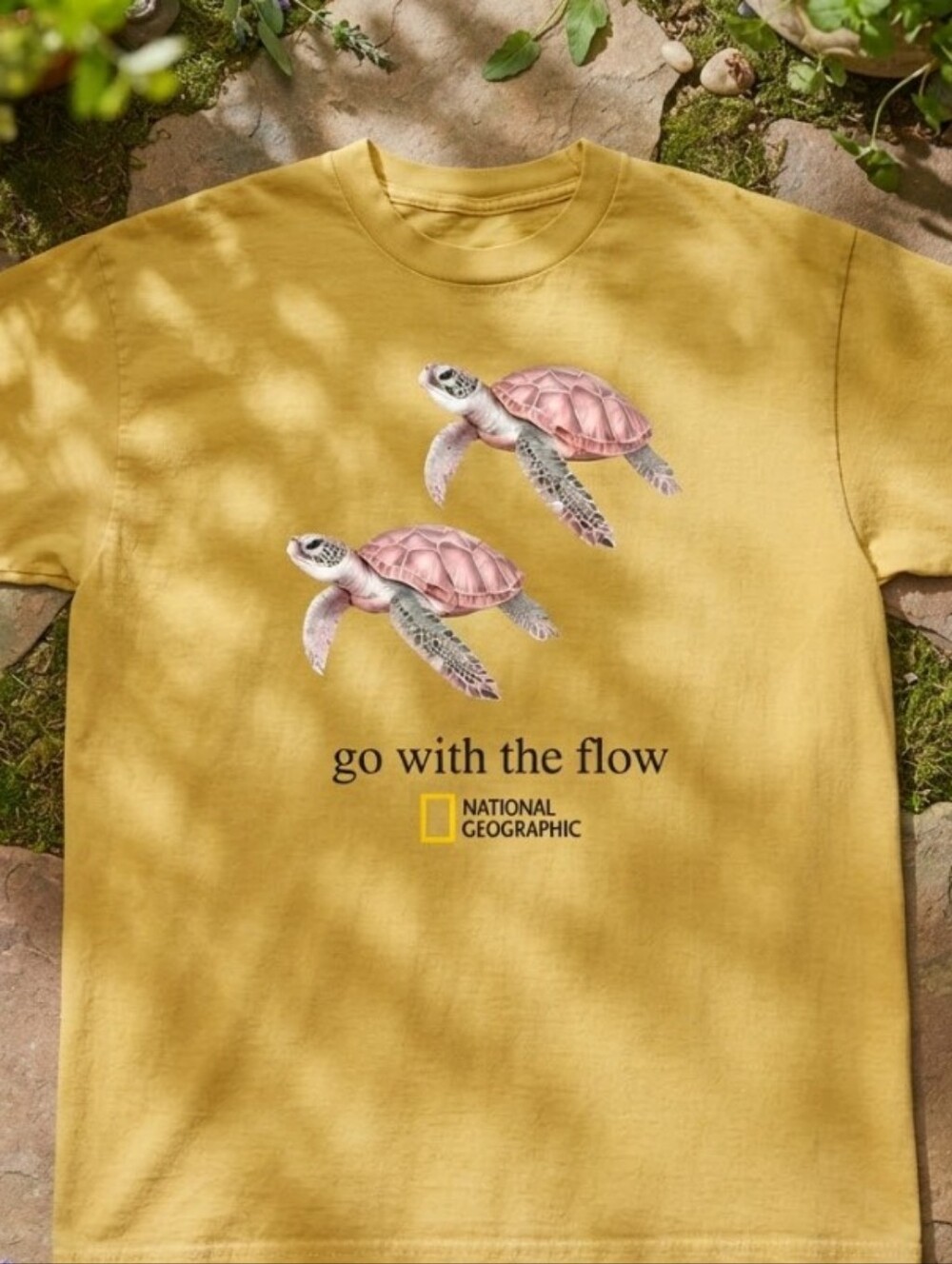 National Geographic turtle with two pink turtles and the words go with the flow
